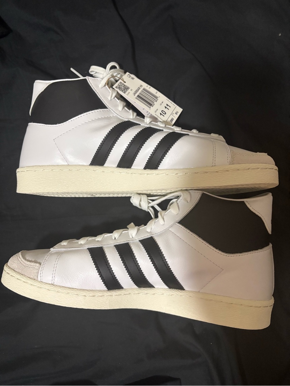 adidas Men’s White and Black Mid-Top Sneakers